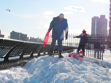 A random family and a mound of snow