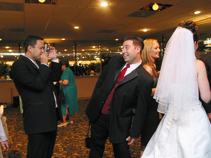 Marc gets his picture taken with the bride