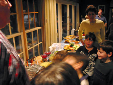 Moroch children and parents light the menorah.