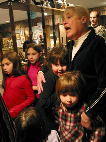 Helen leads Moroch youths in song.