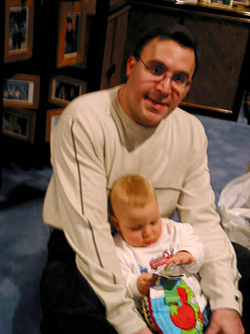 Jeffrey holding his 8 month old son, Bryan.